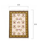 Close-up detail of the Mirzapur rug floral pattern and woven wool texture.