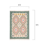 Detailed close-up view of the handwoven texture and intricate geometric diamond motifs on the Mirzapur dhurrie rug