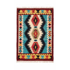 Front view of an artisan Mirzapur hand-woven wool kilim rug with vibrant geometric red and blue tribal patterns