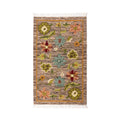 Mirzapur handwoven floral wool area rug top-down flat lay view with fringe details