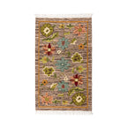 Mirzapur handwoven floral wool area rug top-down flat lay view with fringe details