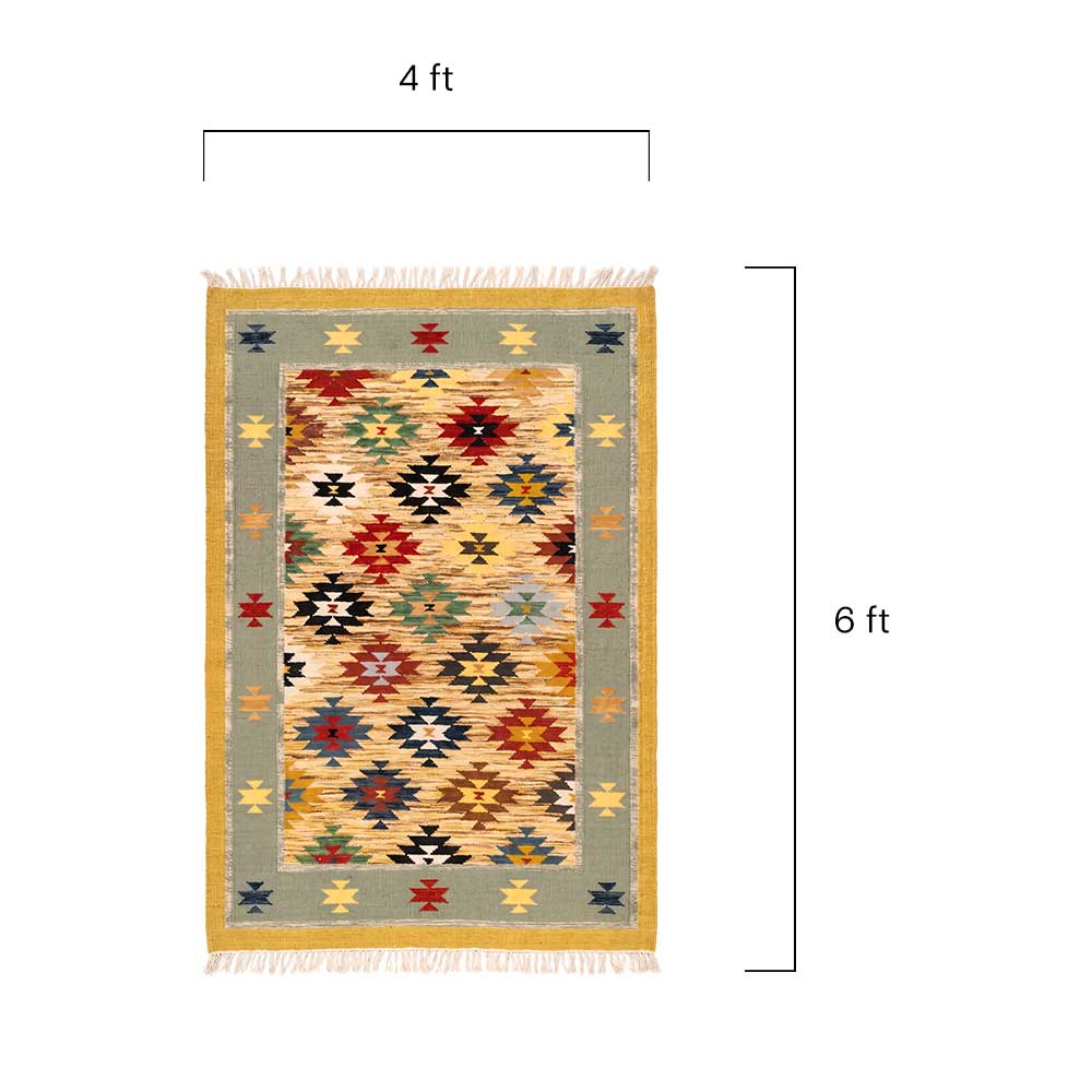 Close-up detail of the woven wool texture and fringe edges of the Mirzapur Kilim rug.
