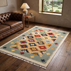 The Mirzapur Kilim rug styled in a modern living room setting showing the scale and pattern.