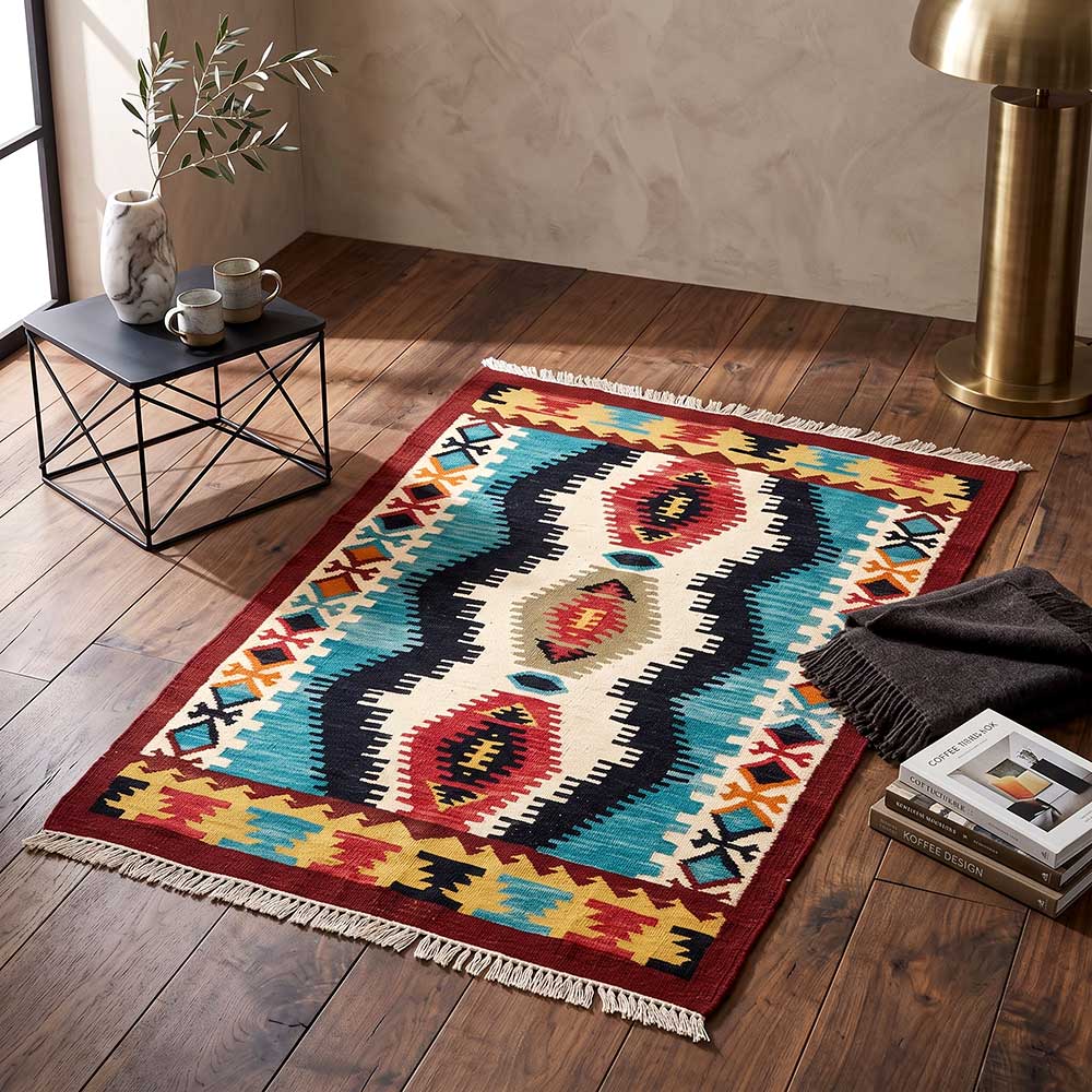 Side angle view of the artisan Mirzapur rug showing the flatweave construction and fringed edges