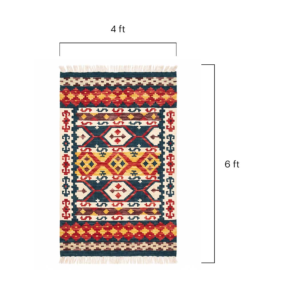 Close-up detail of the hand-woven texture and fiber of the Mirzapur Kilim rug.