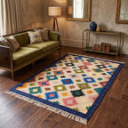 Angled view of the Mirzapur rug displaying the tassel fringe detail and side border stitching.