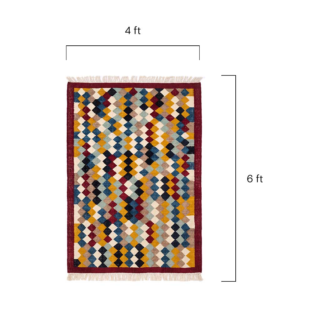 Close-up detail of the hand-woven diamond pattern and natural fiber texture of the Mirzapur rug.