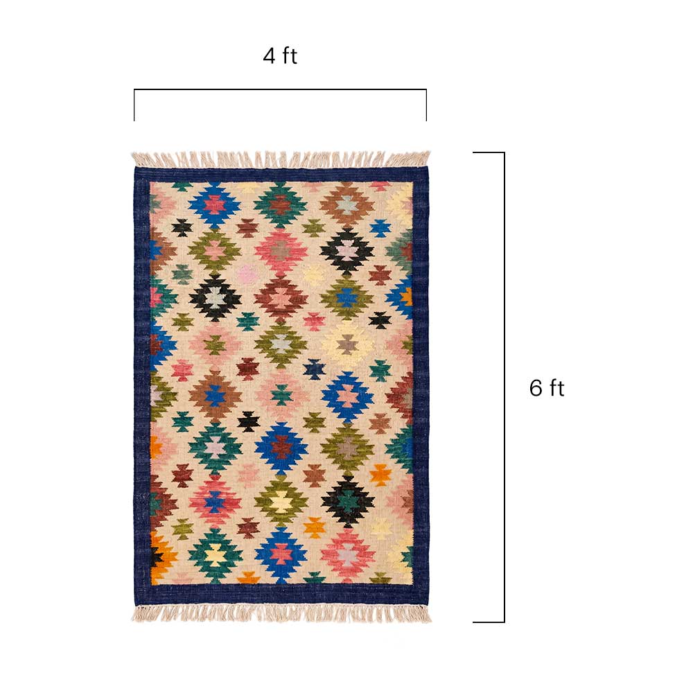 Close-up detail shot of the Mirzapur rug fibers showing the tight hand-woven construction and color variation.