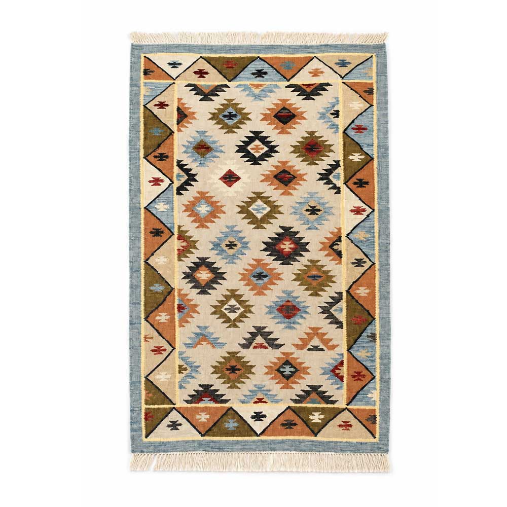 Full top-down view of a rectangular Mirzapur wool kilim rug featuring a colorful Southwestern-inspired geometric pattern with fringe.