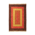 Rectangular rug with brown, red, and yellow pattern on a white background