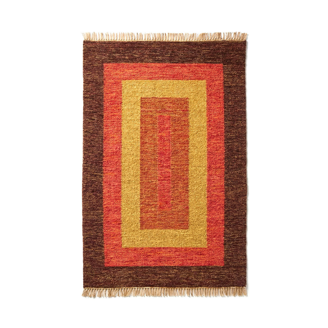 Rectangular rug with brown, red, and yellow pattern on a white background