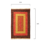 Rectangular rug with brown, red, and yellow pattern and measurements on a white background