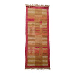 Rectangular runner rug with a geometric pattern on a white background