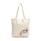 Beige tote bag with playing card designs on a white background