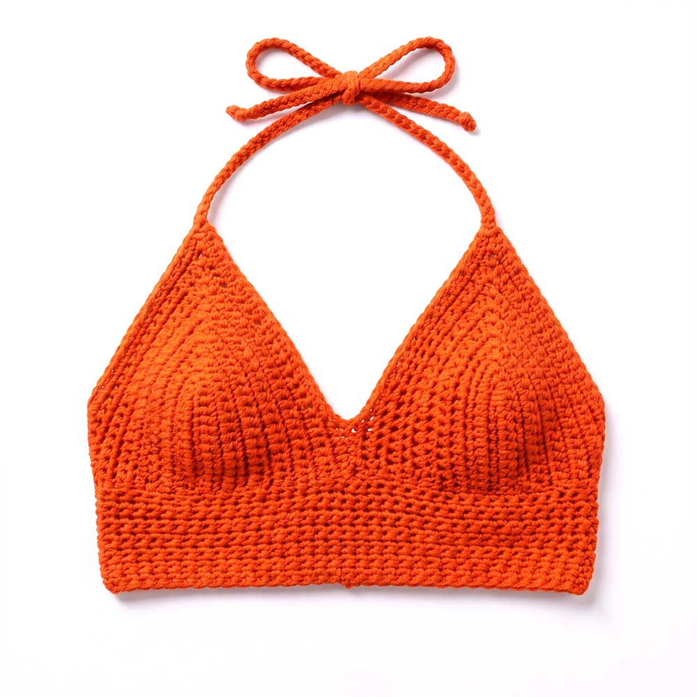 Model wearing red crochet bikini top.