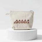 Gota Patti-Embroidered Cream Travel Pouch with Floral Motif