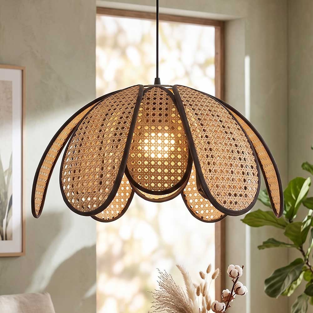 Close-up of illuminated sugarcane flower pendant light hanging in a neutral interior