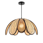 Handwoven natural sugarcane petal pendant light with black trim centered on white background
