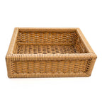 Front view of the handwoven sugarcane storage basket tray on a white background