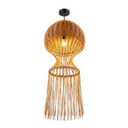 Handcrafted sugarcane woven pendant light with glowing bulb and fringe tassel skirt on white background
