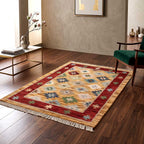 The Mirzapur wool area rug shown at an angle to highlight the low-profile weave and vibrant geometric design.