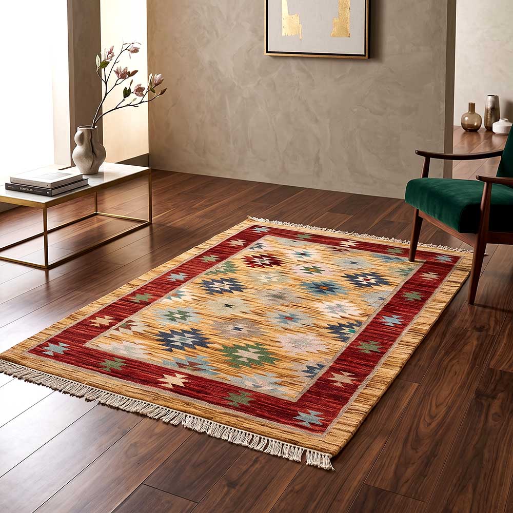 The Mirzapur wool area rug shown at an angle to highlight the low-profile weave and vibrant geometric design.