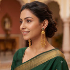 Close-up detail of the floral stone stud and gold filigree work on DI gold plated earrings.