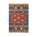 Colorful patterned rug with geometric design on a white background