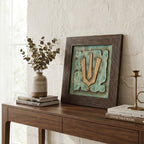 Detailed angle view of the Vishnu Tilak stone painting showing the texture and gold metallic finish.