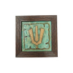 Front view of a handcrafted Vishnu Tilak stone painting with turquoise and gold relief in a wooden frame.