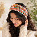 Woman wearing the sunset-colored handmade crochet headband.